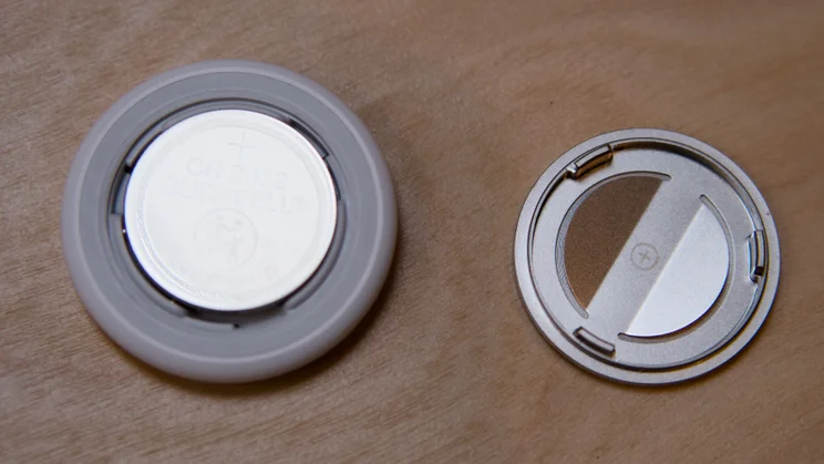 The Apple AirTag (2nd gen) pictured with the rear removed