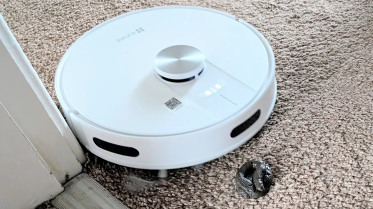 The EzViz RE4 robot vacuum pictured attempting to avoid our fake dog poo