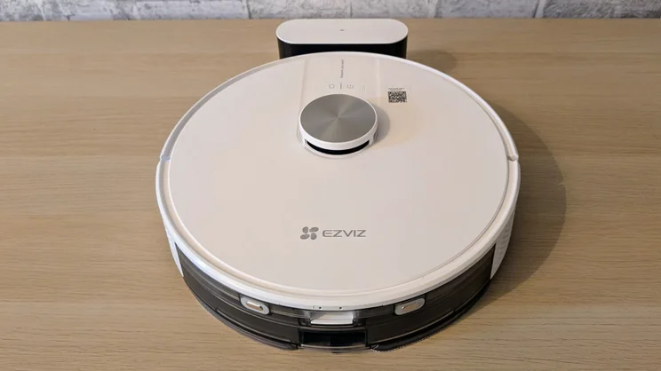 The EzViz RE4 robot vacuum pictured from above connected to its dock