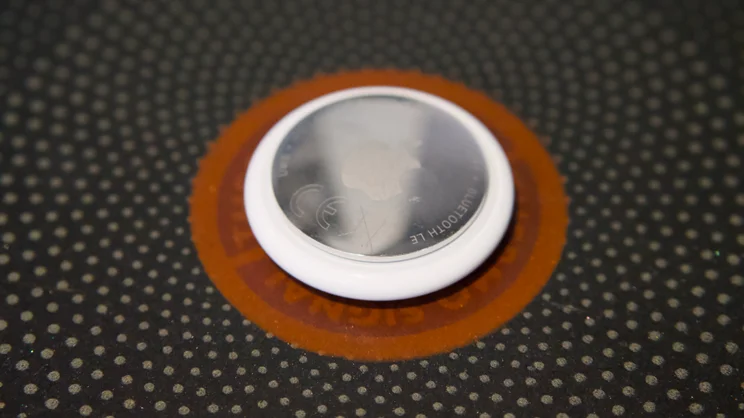 The rear of the Apple AirTag (2nd gen) pictured in close up