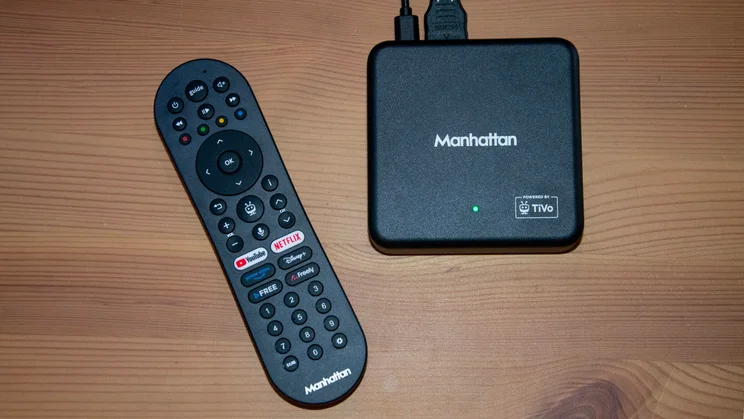 Top-down view of the Manhattan Aero 4K TV Streamer with Freely box and its remote control