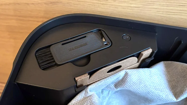A closeup of the Switchbot K11+ robot vacuum's cleaning tool, housed in the top of the base
