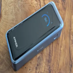 The Anker Prime A110A shown on a wooden table pictured from above, from the right side