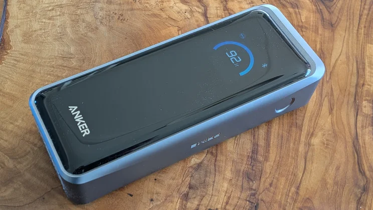 The Anker Prime A110A shown on a wooden table pictured from above, from the right side