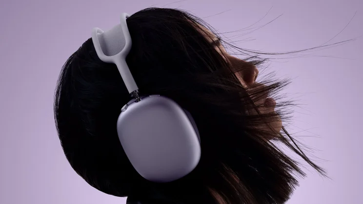 Apple AirPods 2 in purple being worn