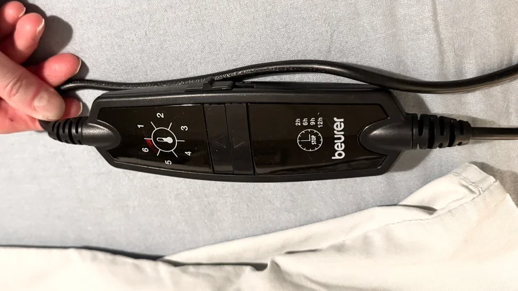 A closeup of the Beurer Indulgence Heated Underblanket's controller