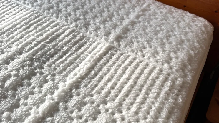 A closeup of the Beurer Indulgence Heated Underblanket's top corner
