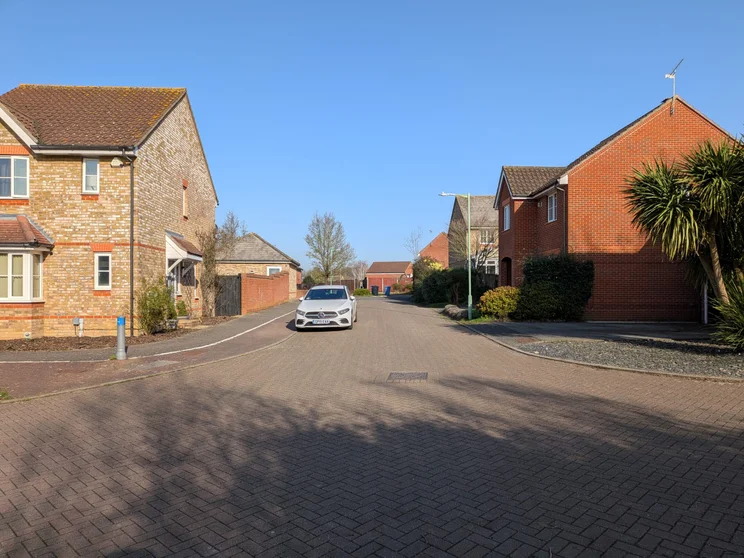 Quiet road with houses on both sides