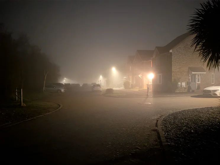 A quiet street on a foggy night