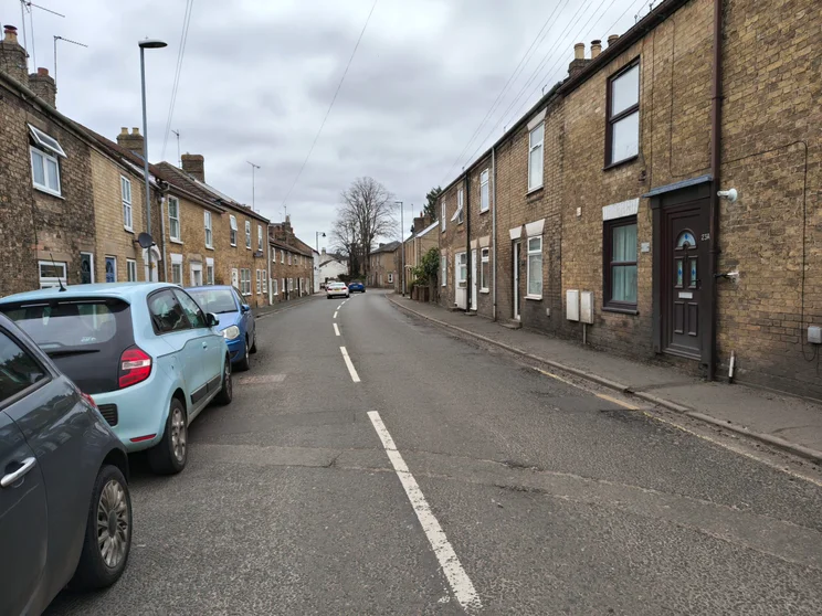 A quiet street with houses on both sides