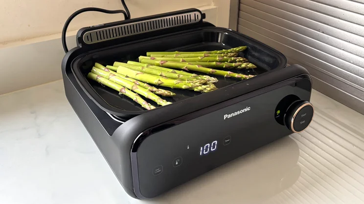 Asparagus cooking on the Panasonic 6-in-1 Table-top Multi Cooker's flat plate
