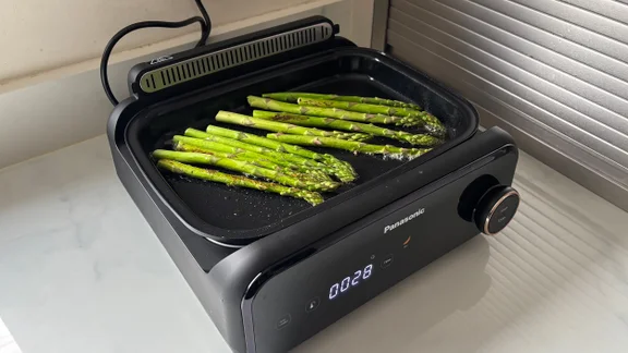 Asparagus cooking on the Panasonic 6-in-1 Table-top Multi Cooker's flat plate