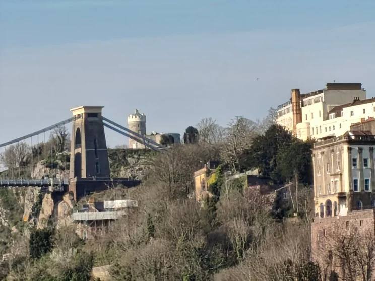 10x zoom shot of a bridge with buildings around it