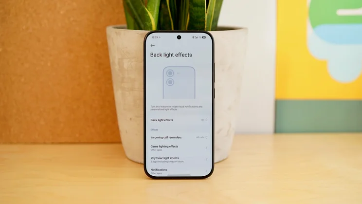 Poco X8 Pro leaning against a plant pot, displaying back light settings