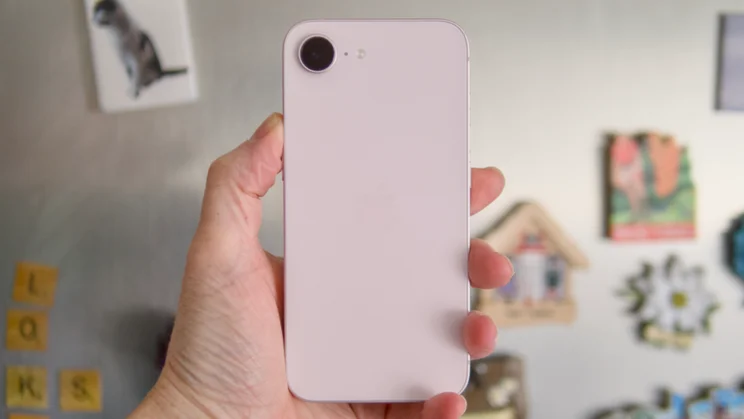 The rear of the soft pink Apple iPhone 17e