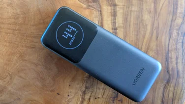 The UGreen Nexode PB724 pictured on its back with the screen on