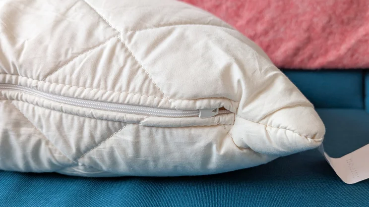 A closeup of the Woolroom Deluxe Washable Wool Pillow's zipper
