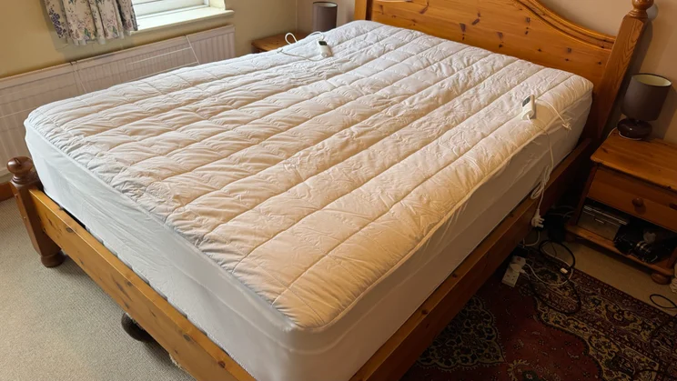 The Dreamland Snowed In electric blanket on a bed in a bedroom