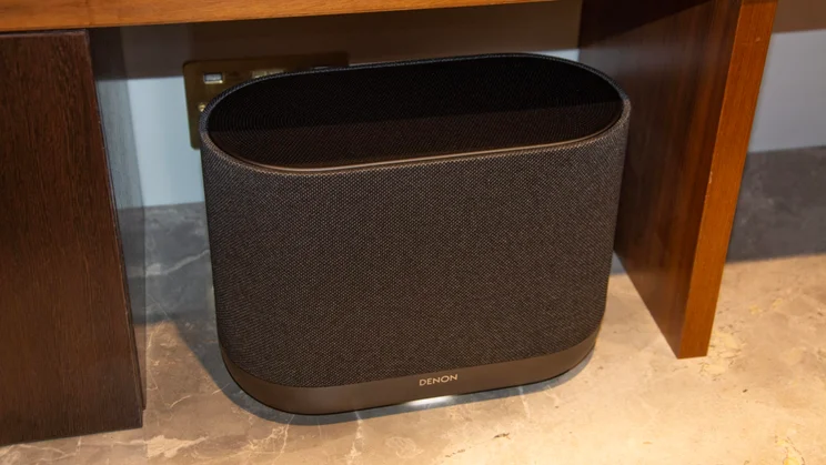 The Denon Home 400 wireless speaker in Charcoal on a marble worktop