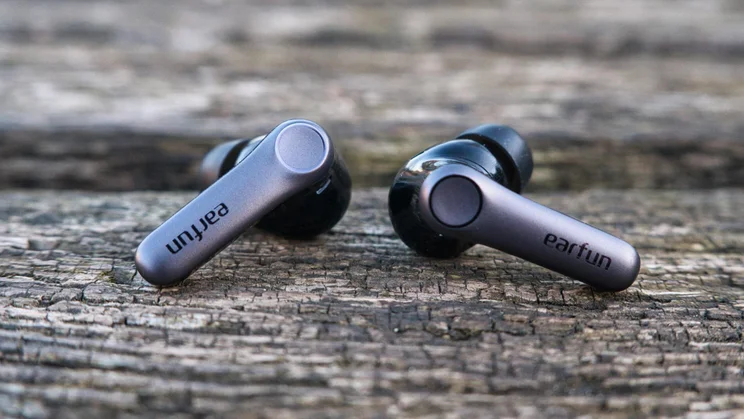 The EarFun Air Pro 4+ wireless earbuds on a bench