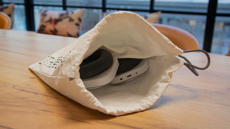 The Nothing Headphone (a) over-ear headphones inside their carrying bag