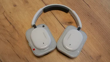 The Nothing Headphone (a) over-ear headphones on a wooden table