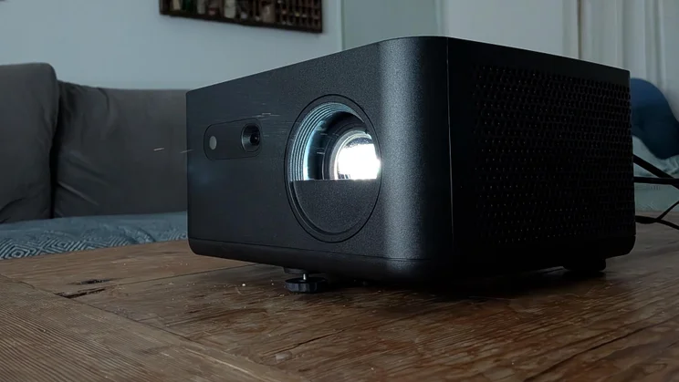 The Optoma Photon Life PK32 projector on a wooden table