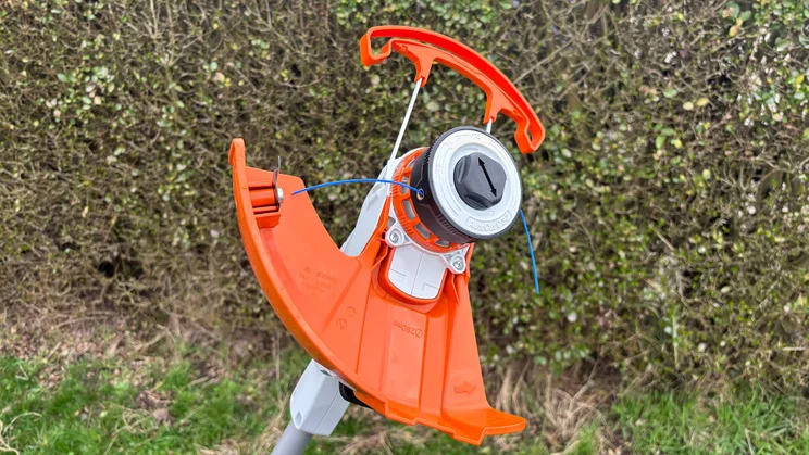 A closeup of the Stihl FSA 50 grass trimmer's cutting head and cutting line