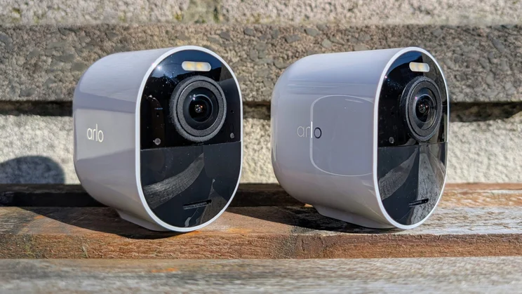 A pair of Arlo Ultra 3 security cameras pictured side by side, from the front