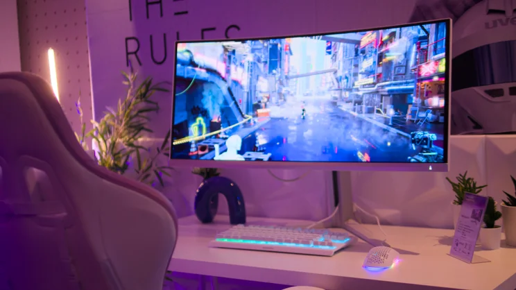 A photo of the Philips Evnia 34M2C8600P on the stand at a press event