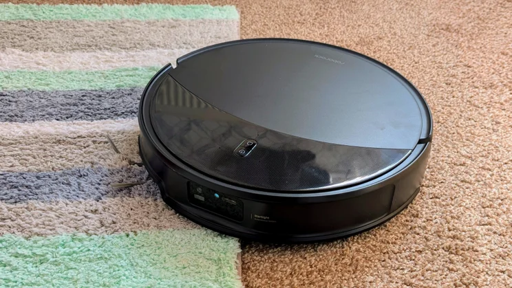 An overhead view of the Roborock Saros 20, cleaning a rug