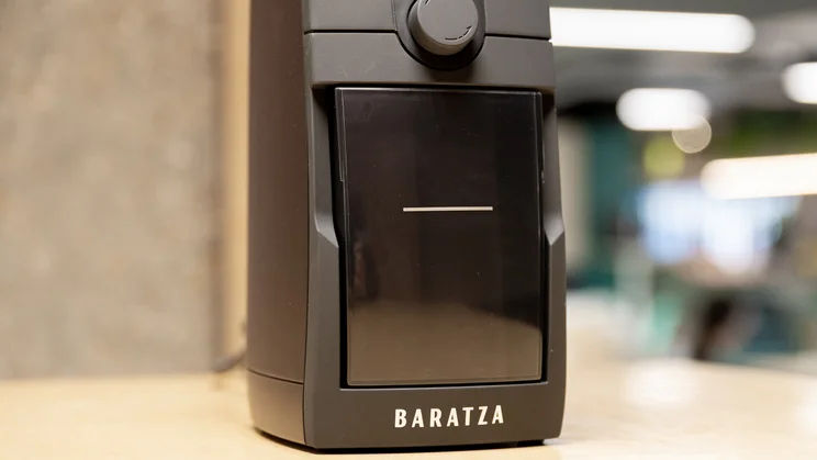A closeup of the Baratza Encore ESP Pro coffee grinder's grounds collection drawer