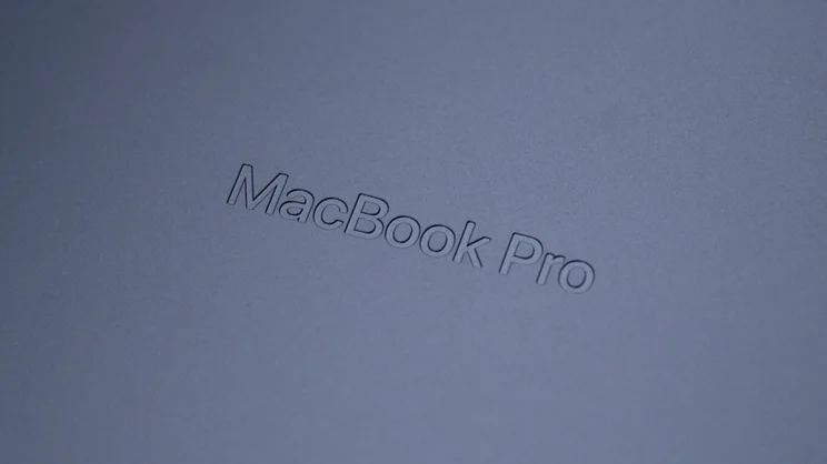 Close up of the MacBook Pro logo on the underside of the 2026 M5 Pro MacBook Pro