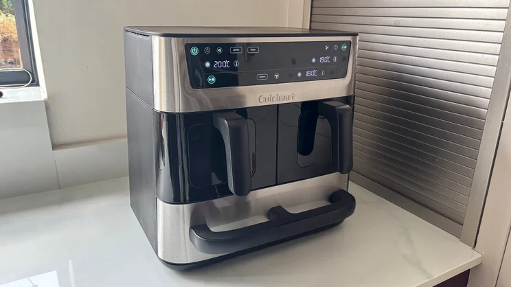 The Cuisinart Tri Zone 13.6l Air Fryer & Oven on a kitchen worktop, its display turned on