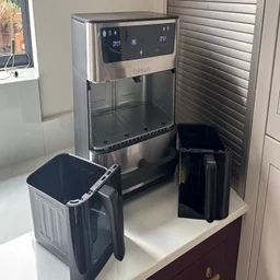 The Cuisinart Tri Zone 13.6l Air Fryer & Oven on a kitchen worktop, with both drawer compartments removed