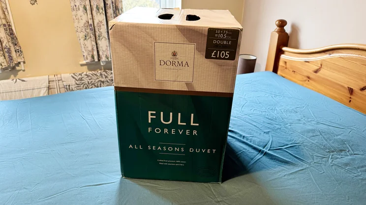 The Dorma Full Forever duvet in its box, on a mattress