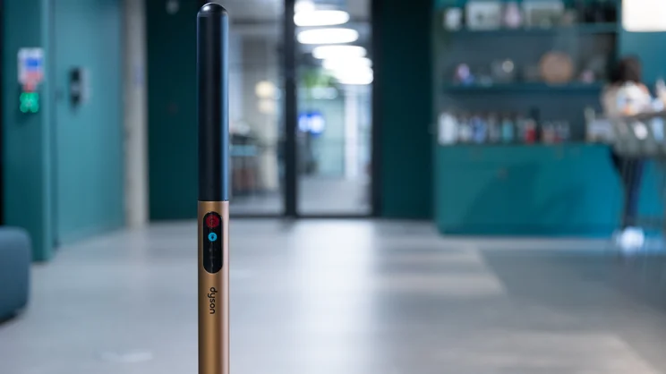 A closeup of the Dyson PencilWash hard floor cleaner's handle and controls