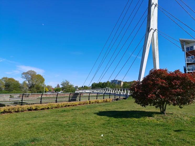 A bridge crossing a river on a sunny day
