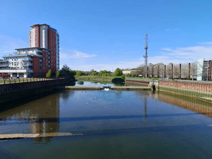 A wide river with buildings on both sides