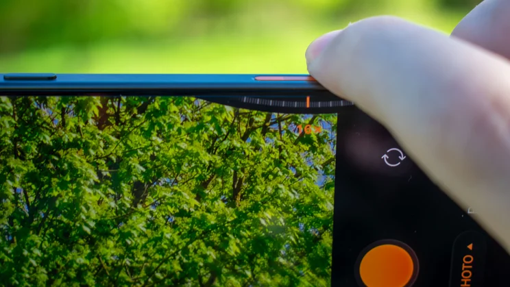 Close up of finger on the Oppo Find X9 Ultra's master shutter button