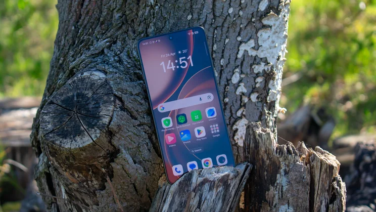 Oppo Find X9 Ultra upright on a tree stump, front view