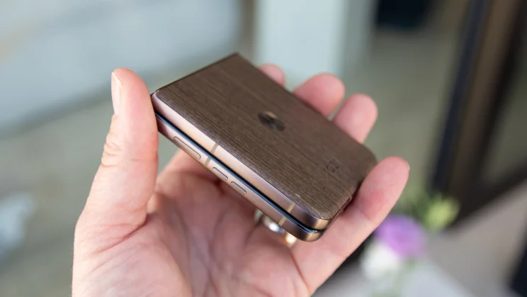 Razr 70 Ultra folded in hand, angled view