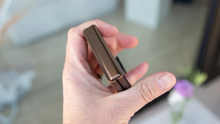 Razr 70 Ultra folded in hand, hinge view