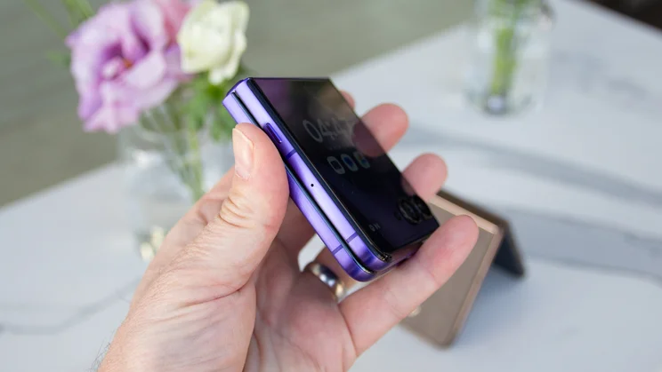 Razr 70 Ultra folded in hand, side view