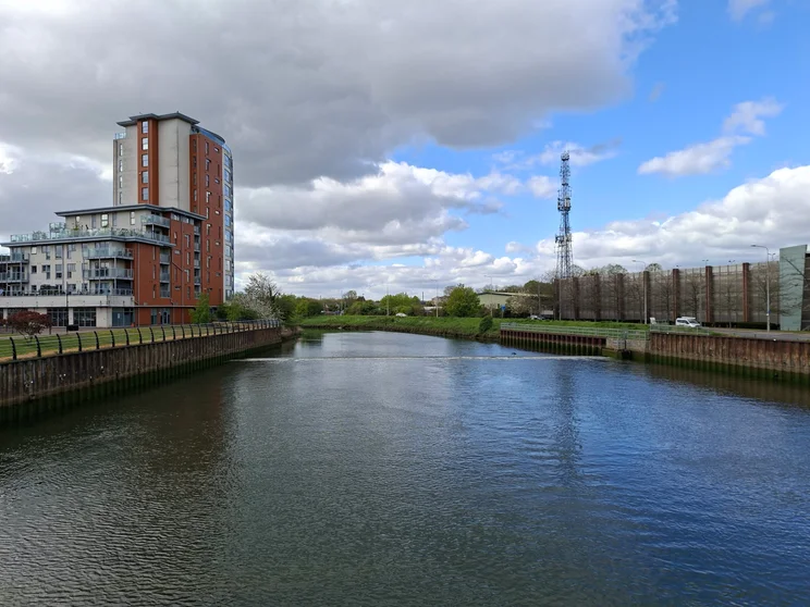 A wide river with buildings on both sides