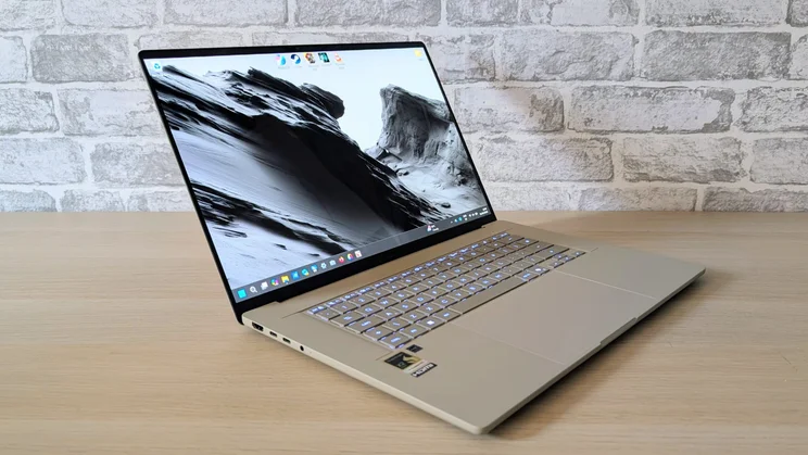 The Asus Zenbook A16, open, pictured from the front left quarter