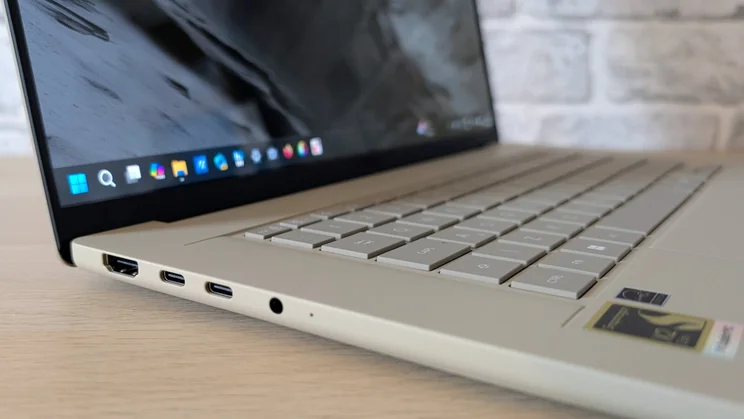 The Asus Zenbook A16, open, with left edge ports shown close up