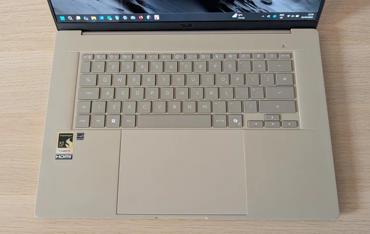 The Asus Zenbook A16's keyboard and touchpad pictured from above