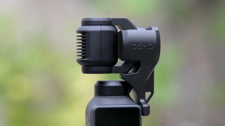 The DJI OSMO Pocket 4 with the gimbal clamp in place