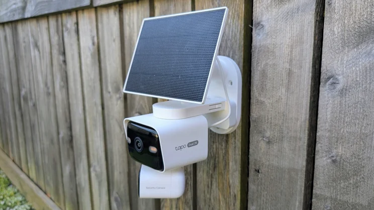 The Tapo C645D, on a fence, pictured from the right